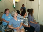 Deana, Sandra, Mom, & Dianne listen attentively to instruction for the first game. Janet is standing.